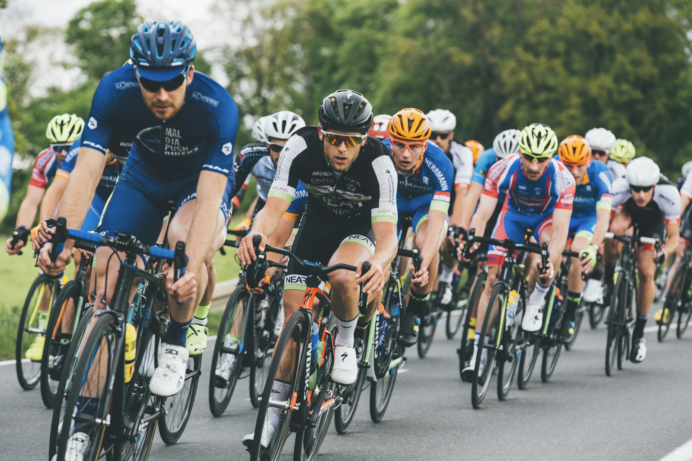A road-cycling peloton in full effort.